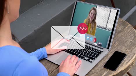 Animation-of-envelope,-changing-numbers-in-circle,-caucasian-female-coworkers-talking-on-videocall