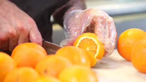 Person Making Orange Juice