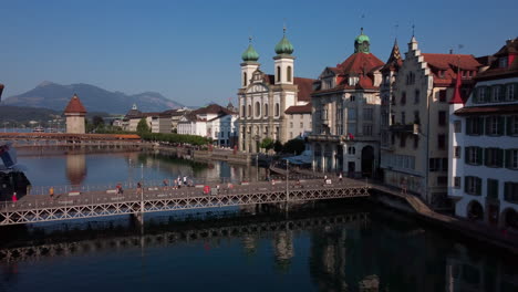 low flight over the hisoric center of lucern on the shores of river reuss