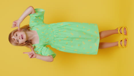 crazy blonde child girl kid making playful silly facial expressions fooling around showing tongue