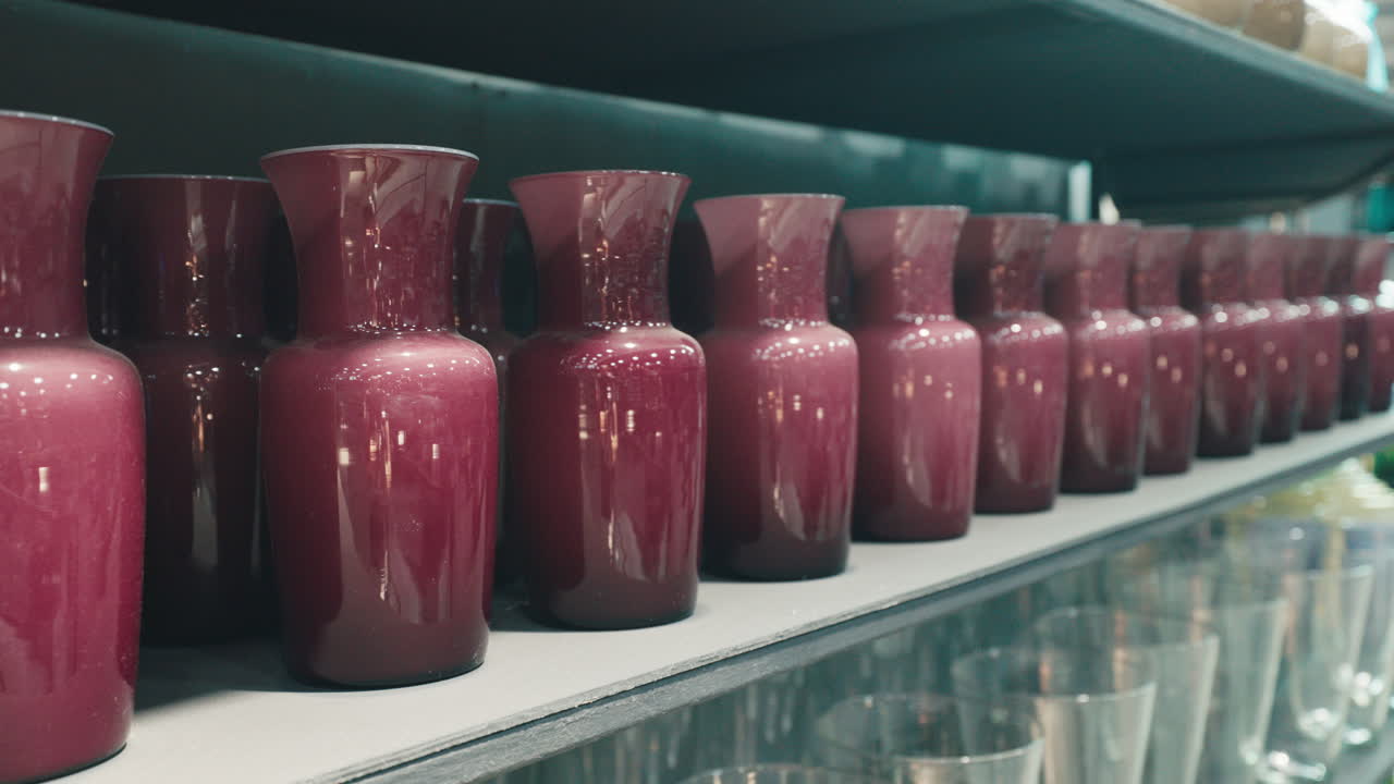 Purple Glass Vases on a Shelf