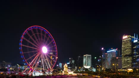 el lapso de tiempo de la rueda gigante de hong kong por la noche