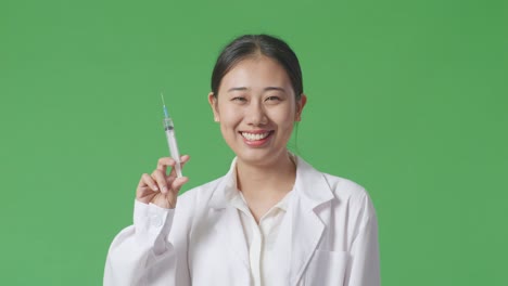 doctor holding syringe