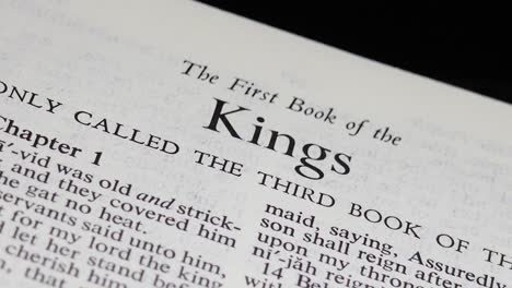 cu bible page turning to the book of first kings