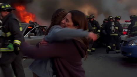 mother and daughter embrace after car crash rescue