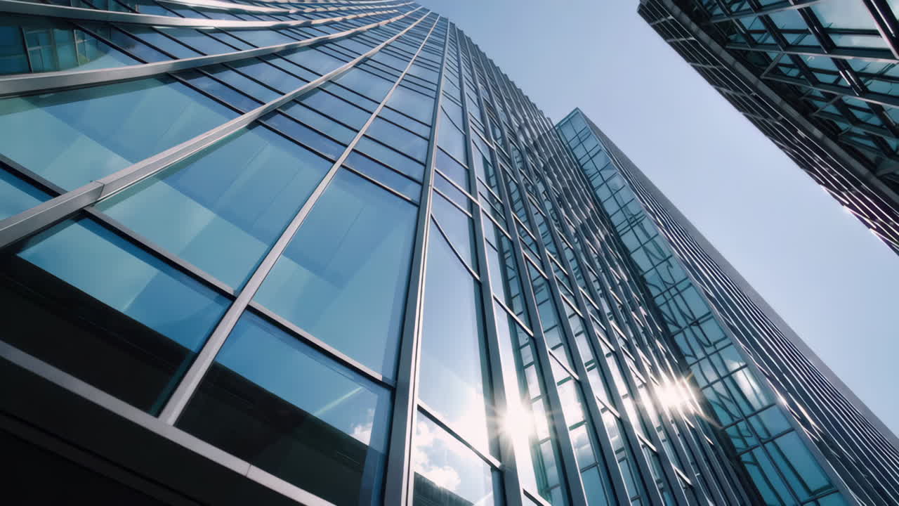 Modern Skyscraper with Reflective Glass Facade Against a Clear Sky