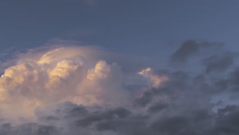 fluffy thick clouds floating in blue sky