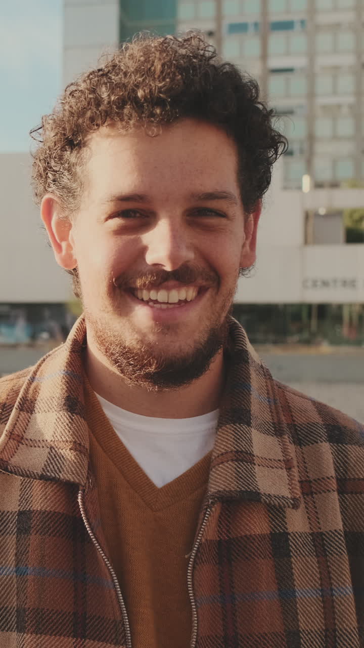 Portrait of a Smiling Man in Plaid Shirt