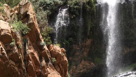 Crocodile-river-waterfall-flowing-and-falling-over-rocks-at-the-walter-sisulu-national-botanical-gardens-in-roodepoort,-South-Africa