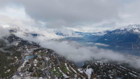 aerial shot in switzerland over the town of crans montana, valais