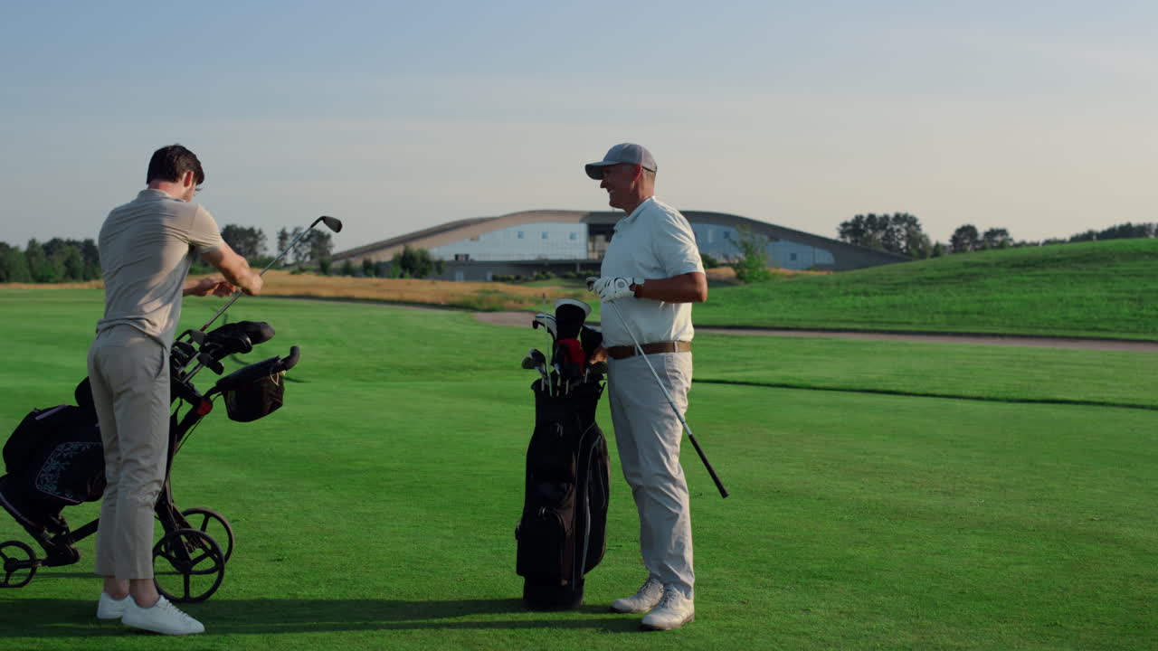 Business partners play golf on course field. Golfing team talking sport outside.