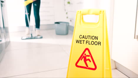 wet, floor and sign for caution