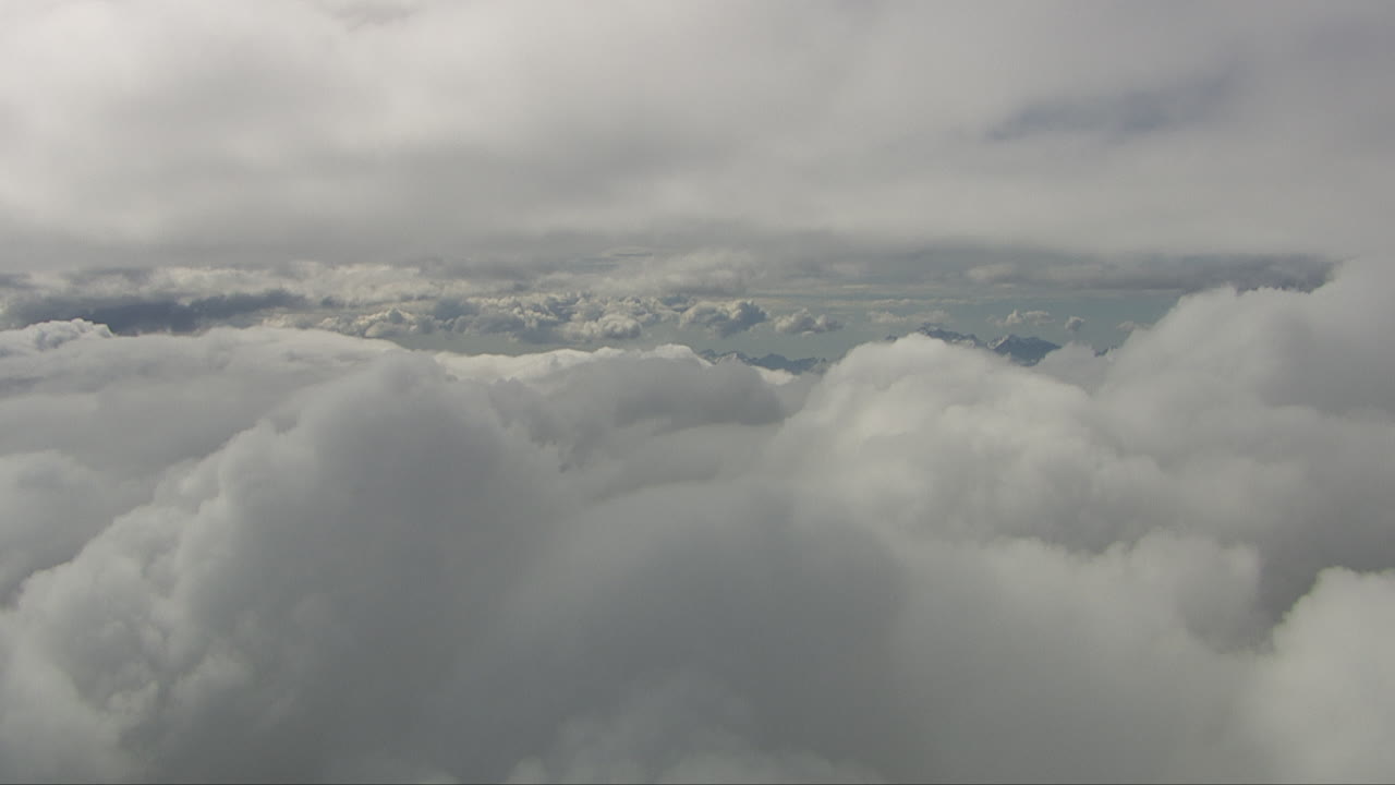 Aerial shot overhead showing the large cumulus formations in the sky