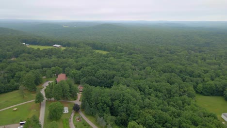 Stunning-aerial-view-on-a-cloudy-afternoon-in-the-woods-of-Ashford,-Connecticut