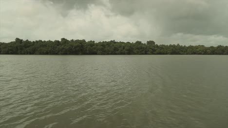 Calm-river-waters-around-the-Goa-area-in-India,-foggy-cloudy-weather