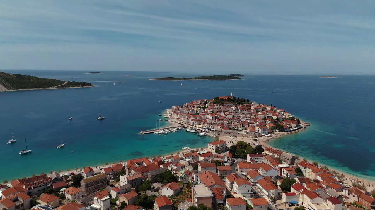 Primošten old town island, Croatia. Beach, historic architecture and scenic Adriatic coastline aerial