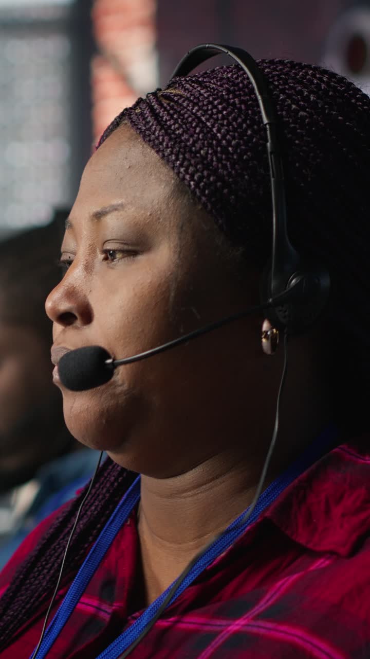 Vertical video Call center agent listening to customer needs, providing step by step guidance