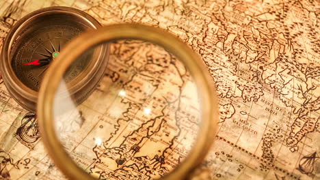 vintage magnifying glass lies on an ancient world map