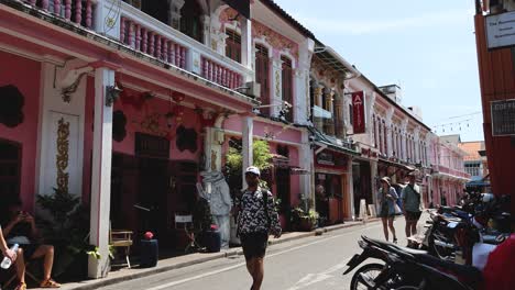 pedestrians walking along a vibrant street