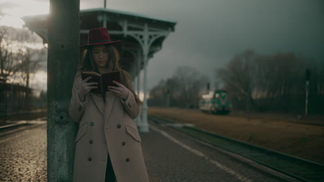 pensive woman outdoors reading