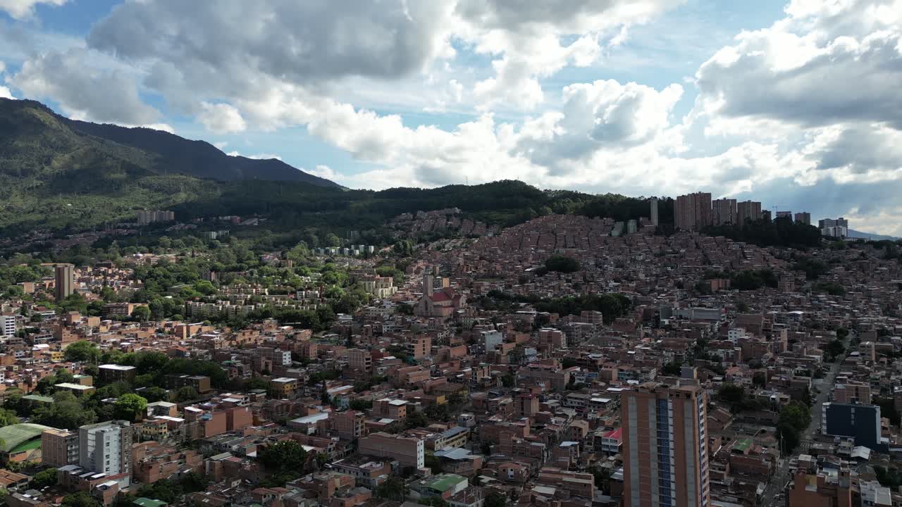 Experience Medellín, Colombia, through an aerial view capturing its vibrant cityscape, surrounded by the majestic Andes Mountains and lush greenery. Perfect for cultural and travel-focused projects.