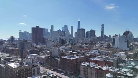 horizontal drone push-in shot over broome avenue in new york, showcasing the city's vibrant streets, historic buildings, and skyline with a smooth forward aerial approach.