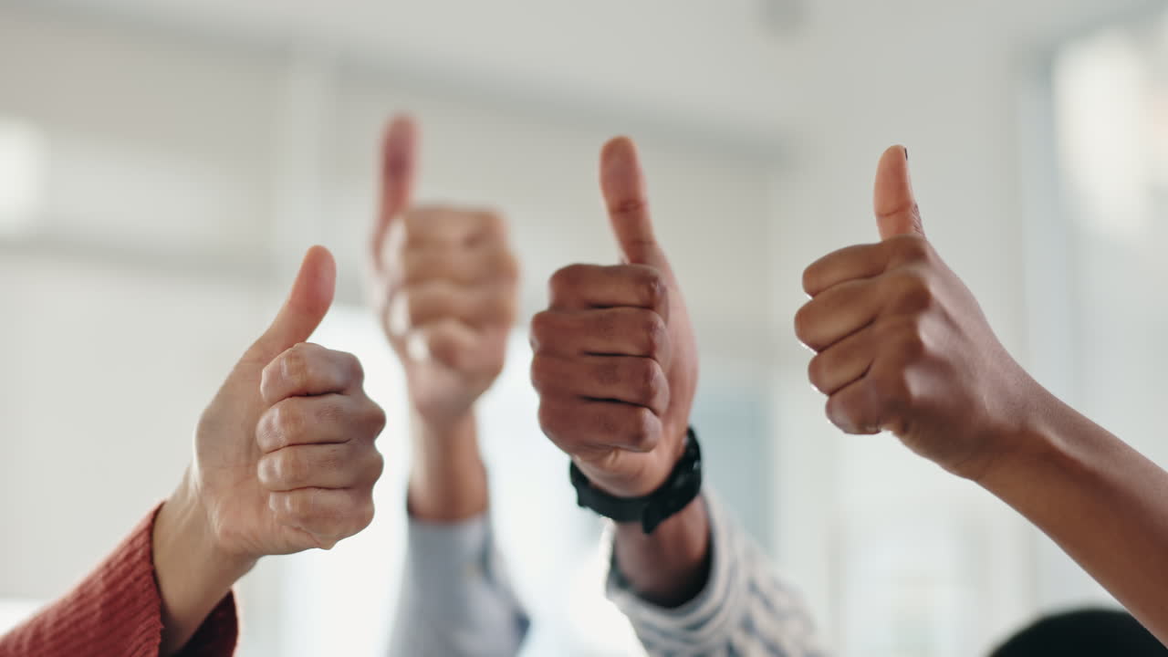Group of people giving thumbs up