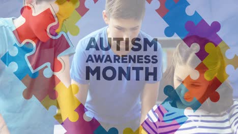 animation of autism awareness month text over diverse schoolchildren using tablet