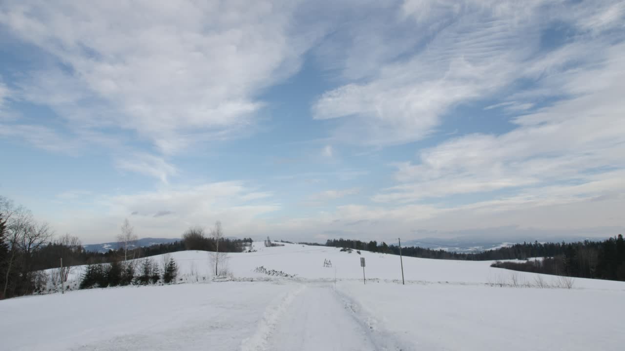 Winter Landscape with Blue Sky and White Clouds