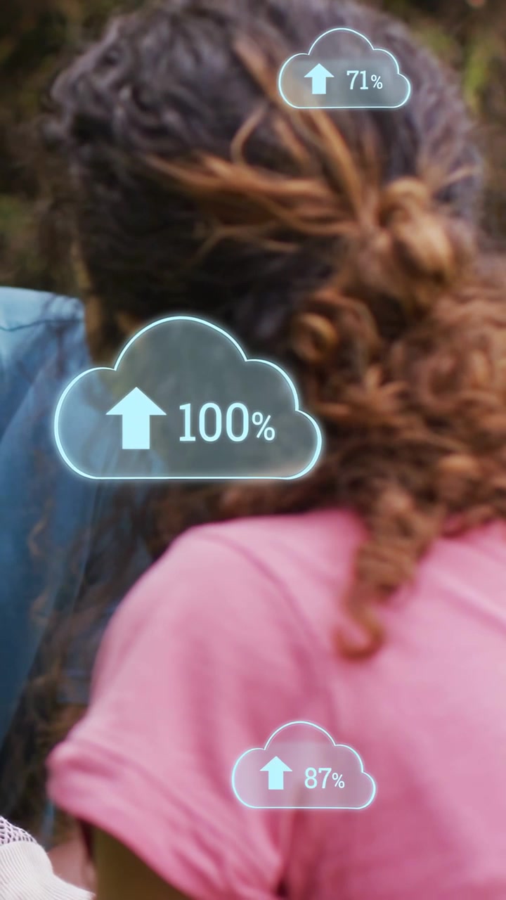 Vertical video: Woman in pink tee, initial cloud fading in over her back and filling percent to 100