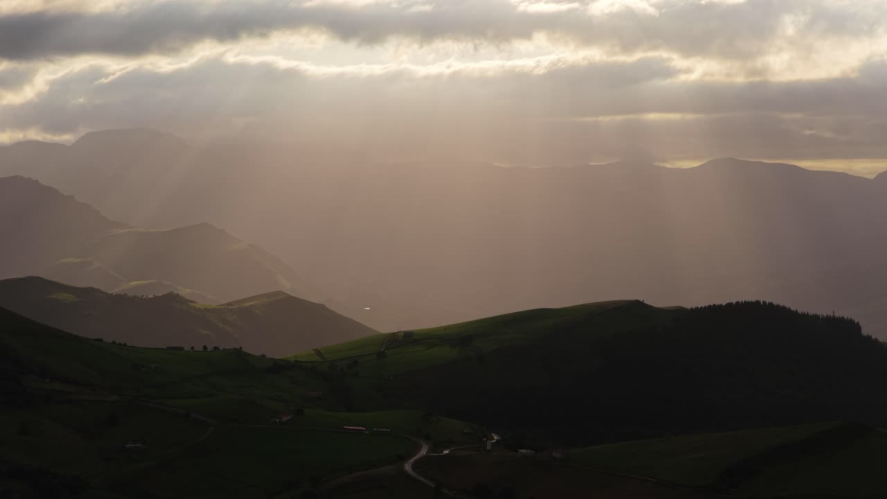 Majestic sunlight piercing through clouds over cantabrian mountains