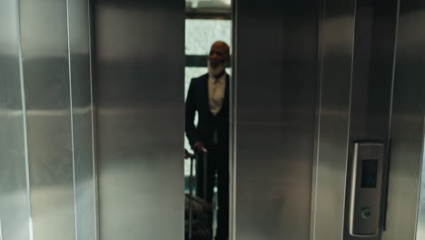 Elevator,-luggage-and-business-people-at-airport