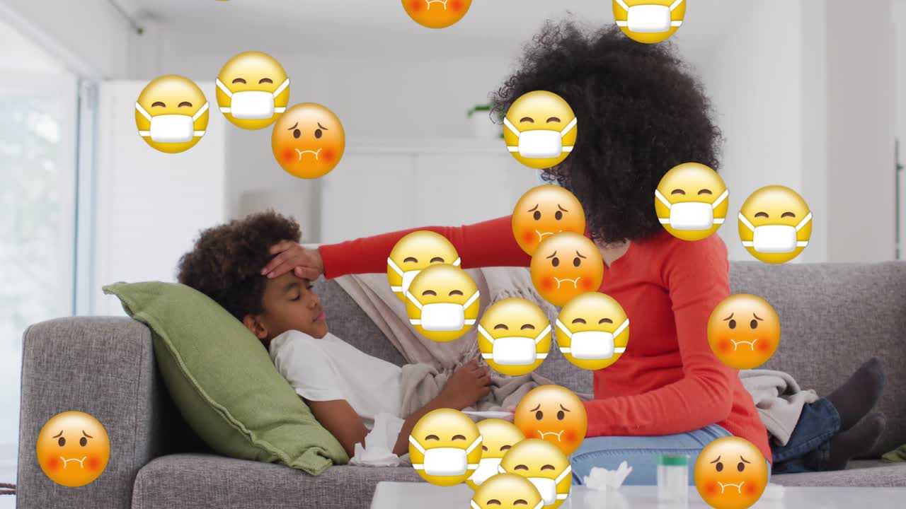 Animation of falling emojis over woman using smartphone