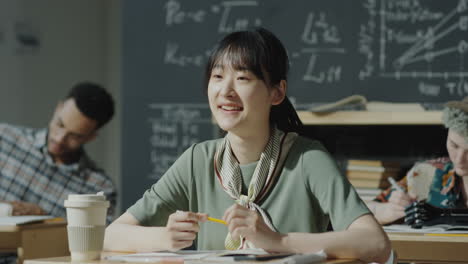 smiling young woman in a classroom setting
