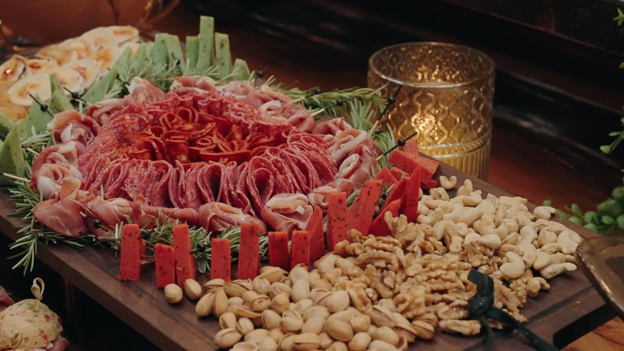 rustic charcuterie table filled with meat cheese and artisan snacks