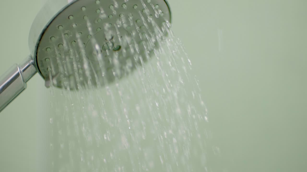 Close-up of a Shower Head with Running Water