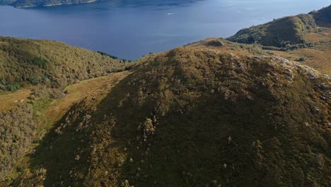 Aerial-over-the-rugged-hills-and-lakes-near-Lauvstad-in-the-Volda-Municipality,-Norway