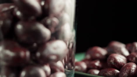 purple candies in a glass