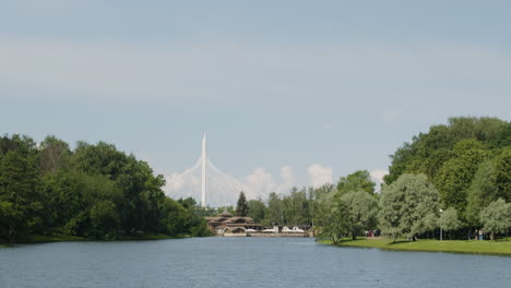 scenic view of a bridge surrounded by trees and water