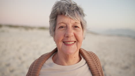 smile, face and senior woman on beach to relax