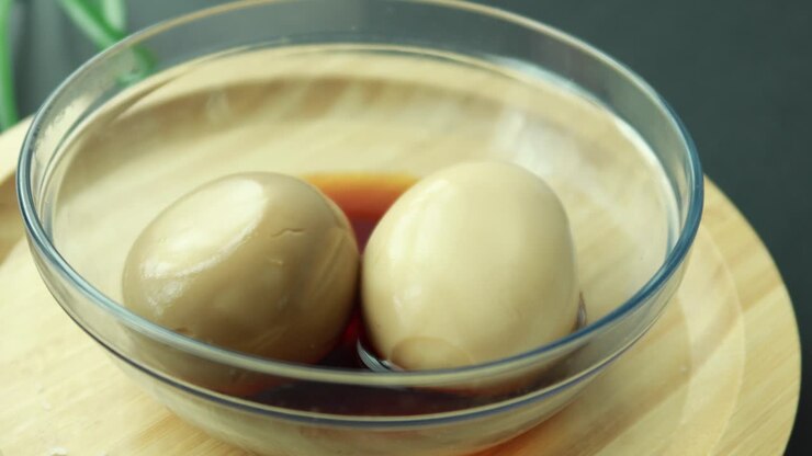 Soy Sauce Marinated Eggs in a Glass Bowl