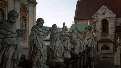 stone figures of the twelve apostles on the fence of the church of saints peter and paul in krakow, poland