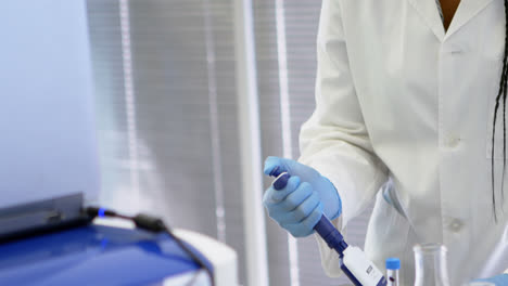 scientist using multi channel pipette 4k