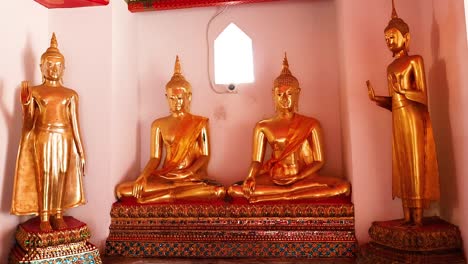 buddha statues in wat pho, bangkok, thailand