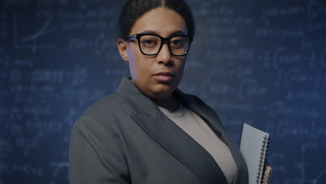 portrait of a confident woman in a classroom
