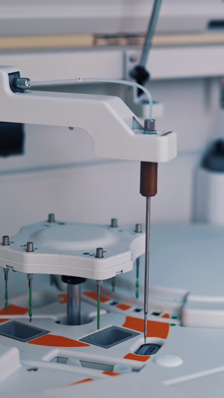 Functional medical laboratory with biochemical analyzer in it. Working process of automated machine in a laboratory. Chemical and biological laboratory of examining blood. Vertical video