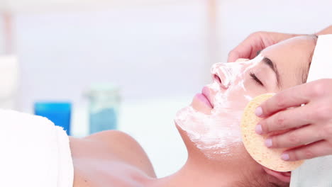 woman enjoying a facial treatment