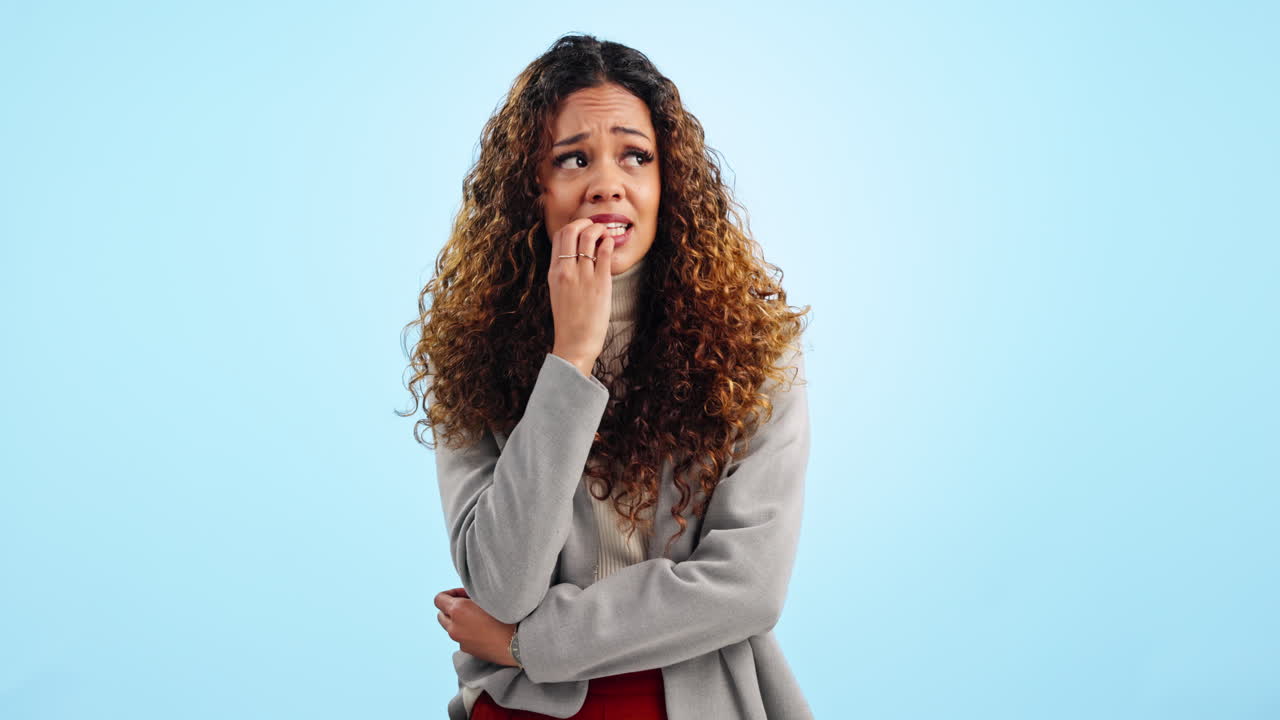 Woman, studio and biting nails with anxiety