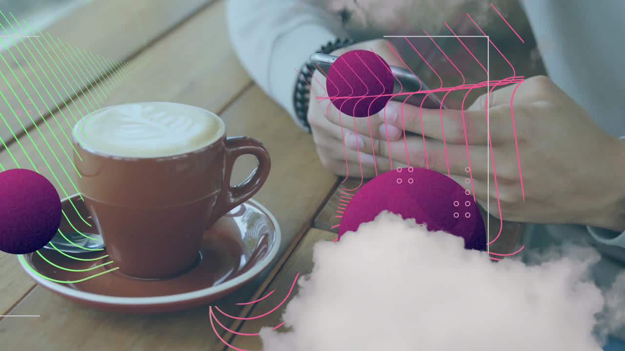 Latte art coffee beside person using smartphone with abstract animation overlay
