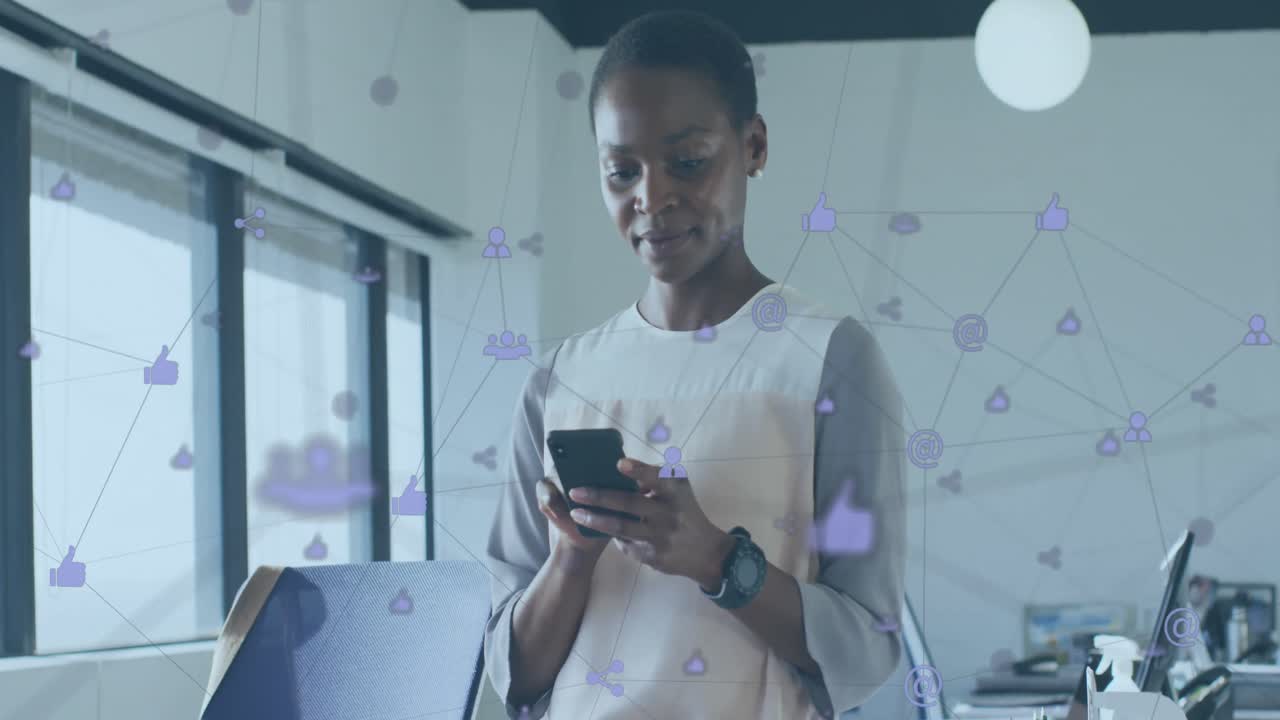 Animation of connected icons over african american woman using cellphone in office